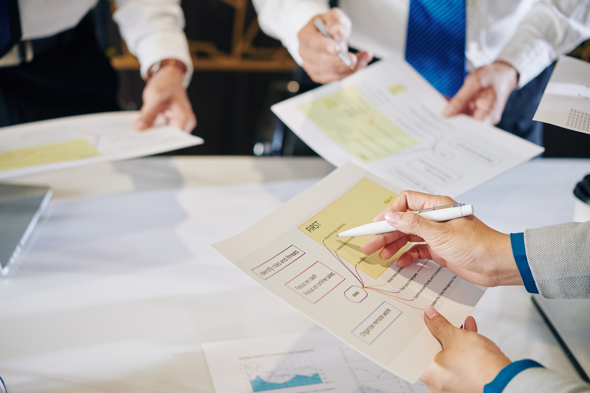 Businesswoman reading plan of anti crisis measures